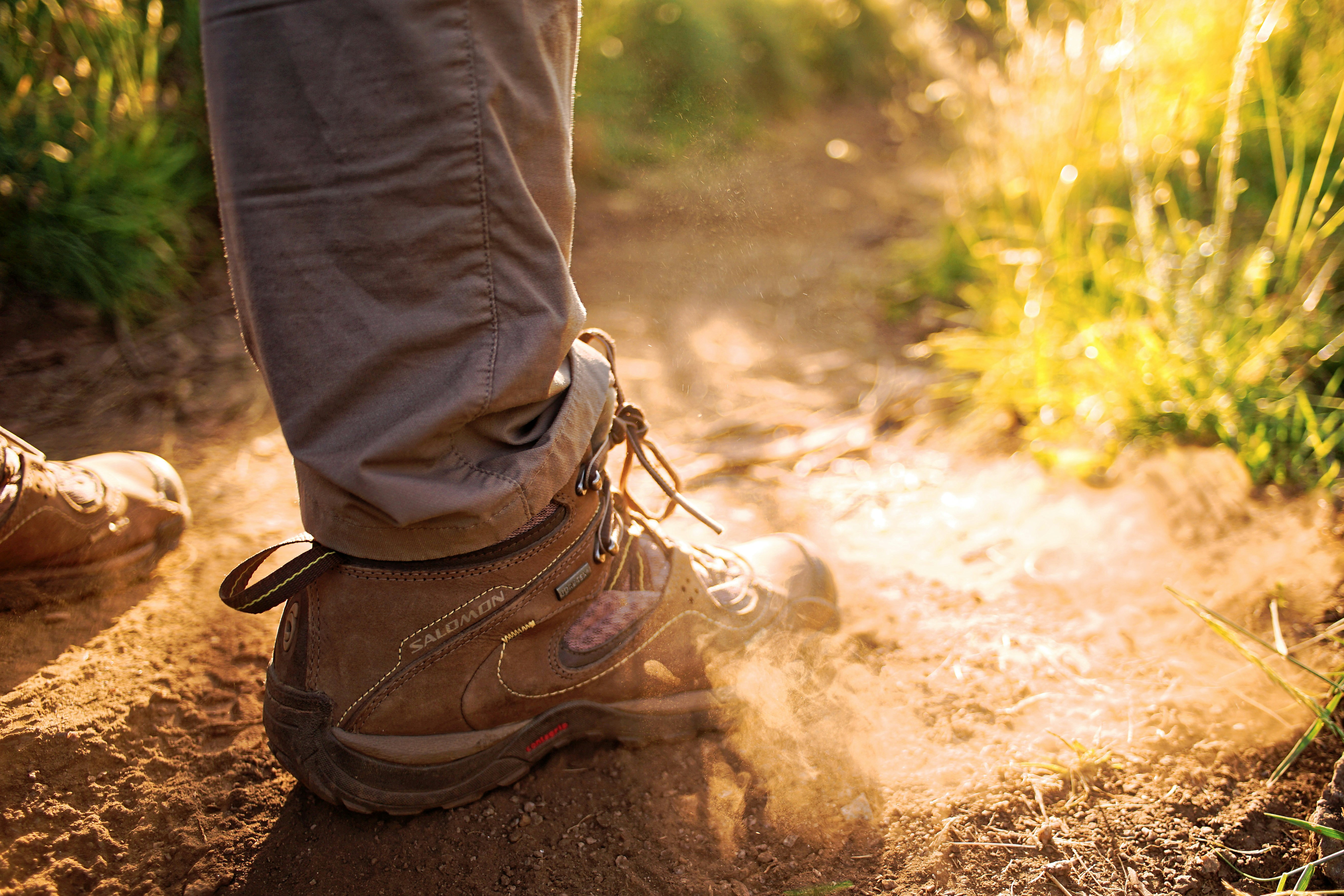 person wearing pair of brown sneakers